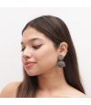 Silver-toned earrings with floral studs and a half-moon design