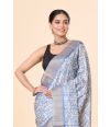 Off-White & Blue Semi Tussar Saree with Abstract Printed Body, Embroidered Pallu & Zari Border