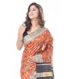 MULTI COLOURED FLORAL PRINT ON BRICK RED GHICHHA TUSSAR WITH CONTRAST BORDER & BLOUSE PIECE