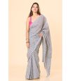 printed cotton saree with a classic white base & delicate blue floral motifs