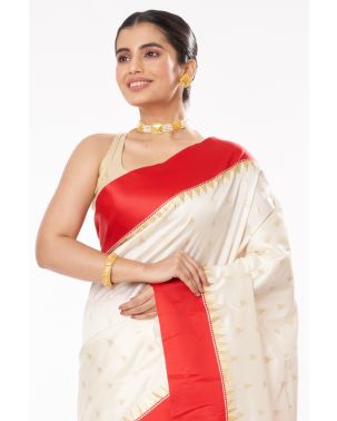 QUINTESSENTIAL OFF WHITE BODY, RED BORDER GARAD, ALL OVER ZARI BUTA WITH GORGEOUS RED COTTON SILK ROUND NECK, BACKLESS BLOUSE (PADDED)