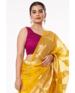 YELLOW SOFT ORGANZA BANARASI GOLDEN ZARI BUTA, GOLDEN BORDER TEAMED WITH PURPLE SOFT COTTON BLEND SELF WORK BLOUSE